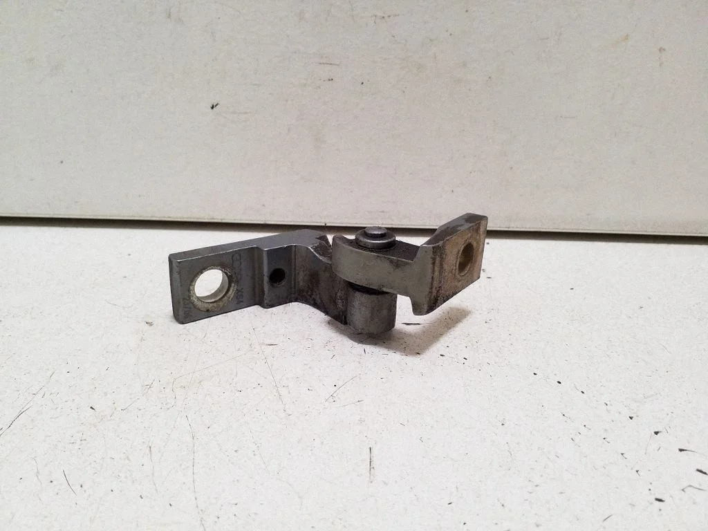 Front door upper hinge – left