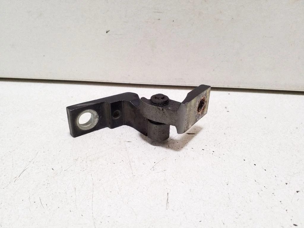 Front door upper hinge – left