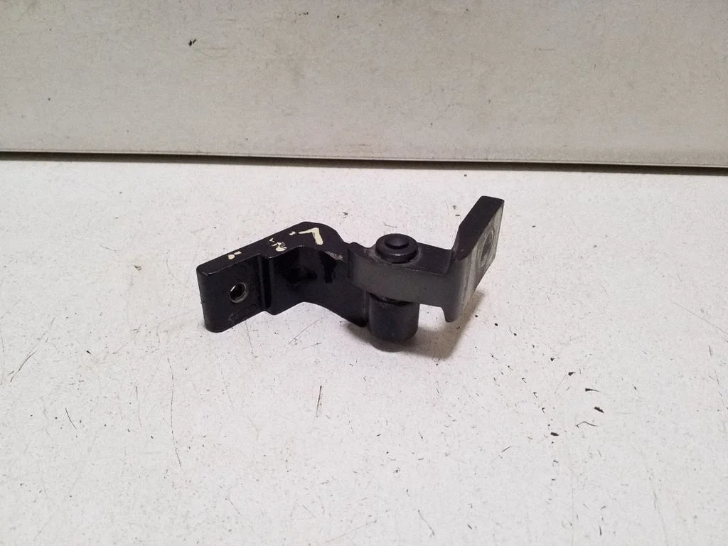 Front door upper hinge – left