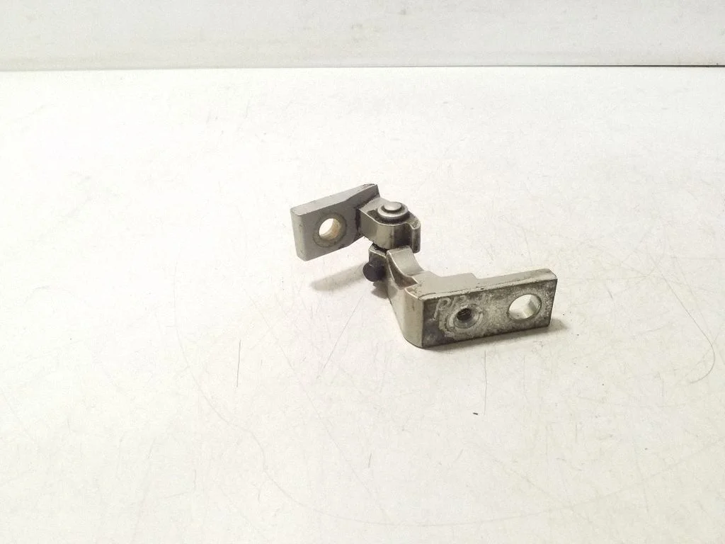 Front door upper hinge – left