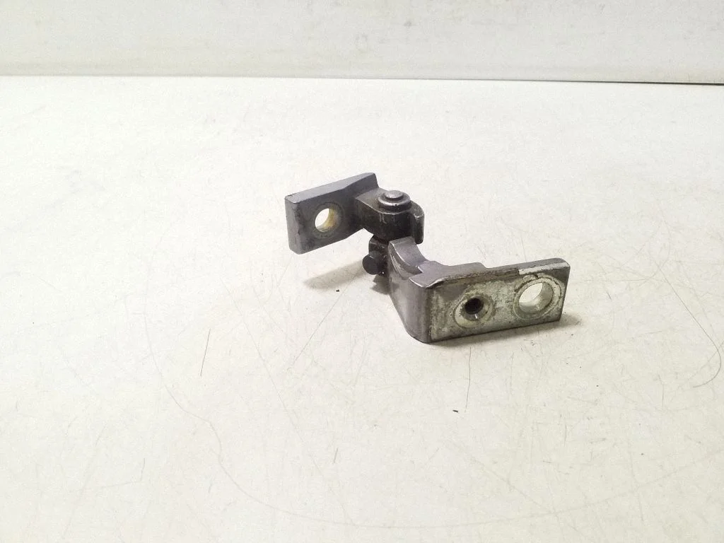 Front door upper hinge – left