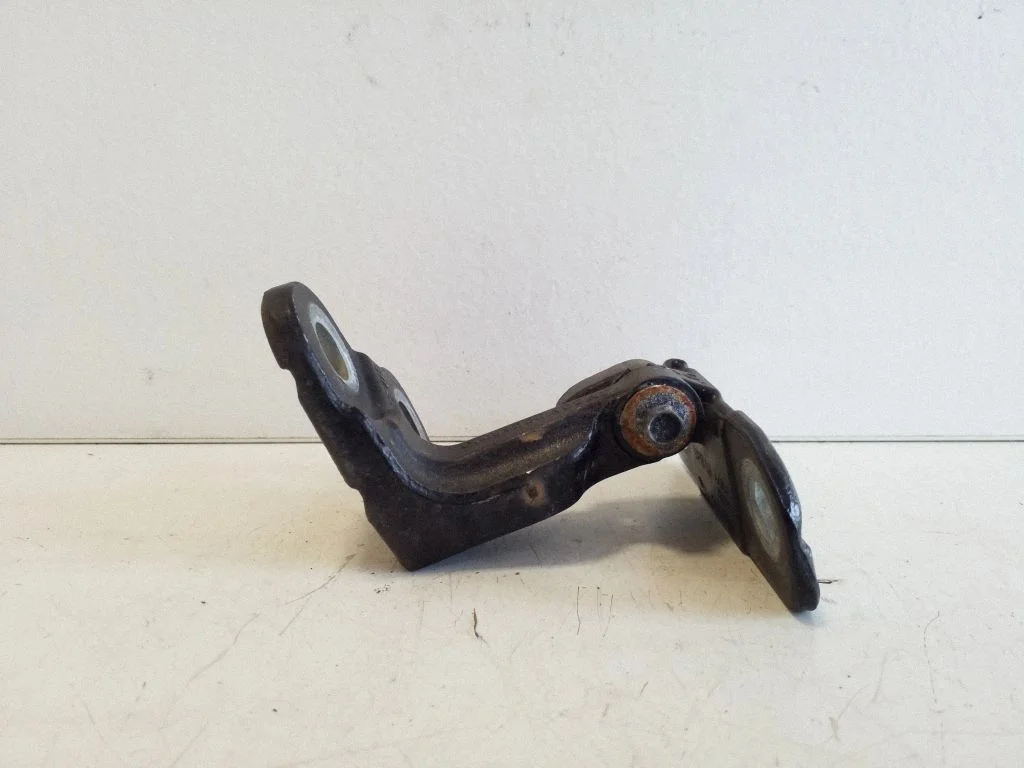 Front door upper hinge – left