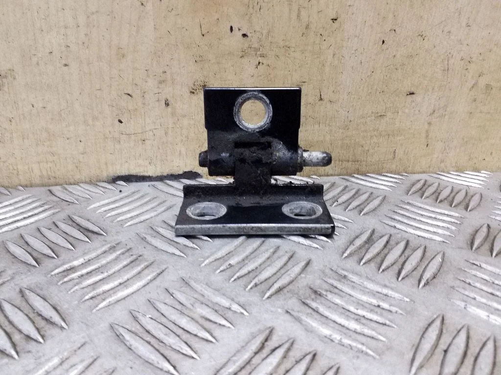 Front door upper hinge – left