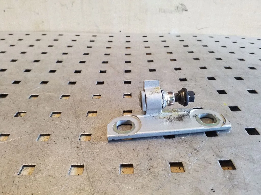 Front door upper hinge – front left