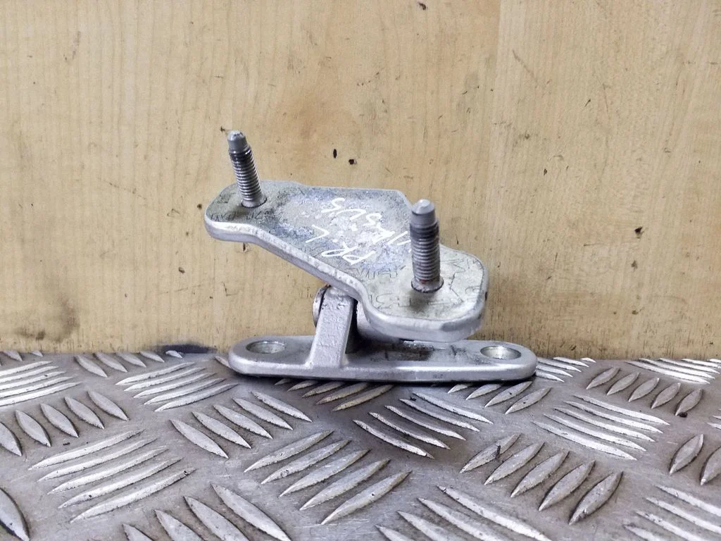 Front door upper hinge – left
