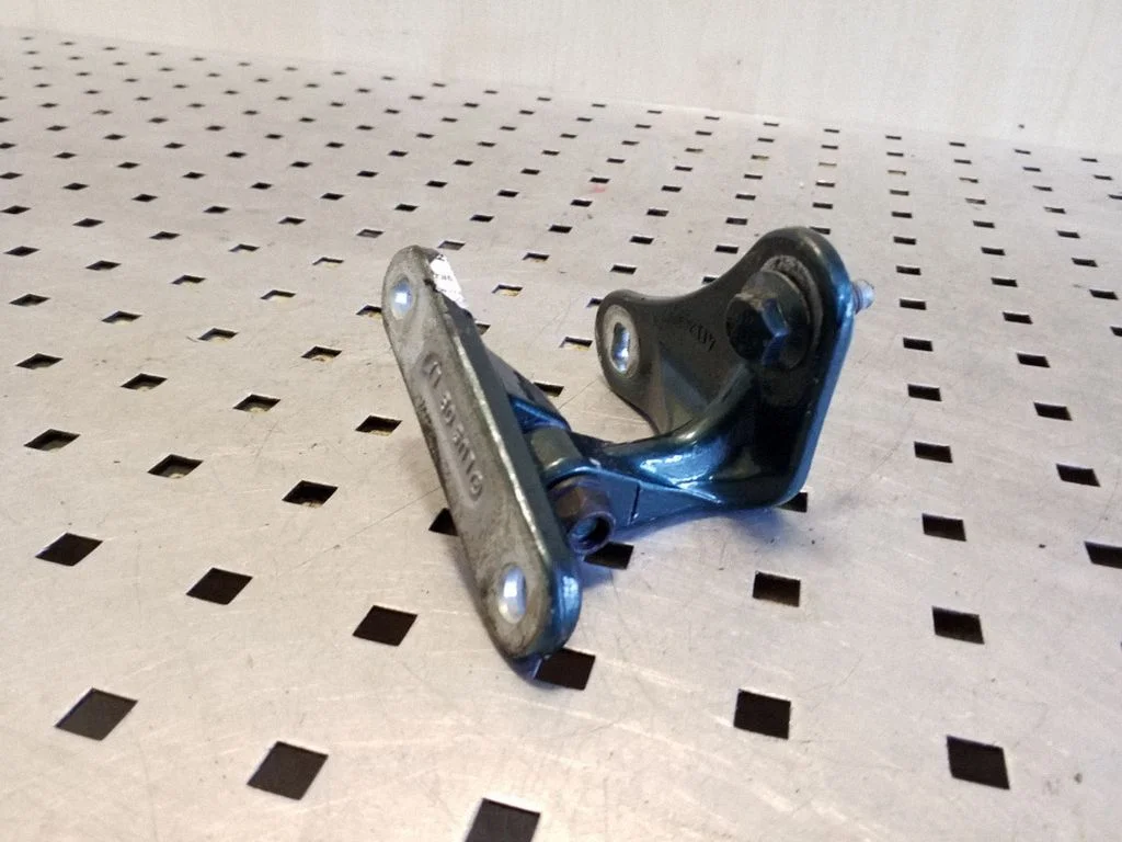 Front door upper hinge – left