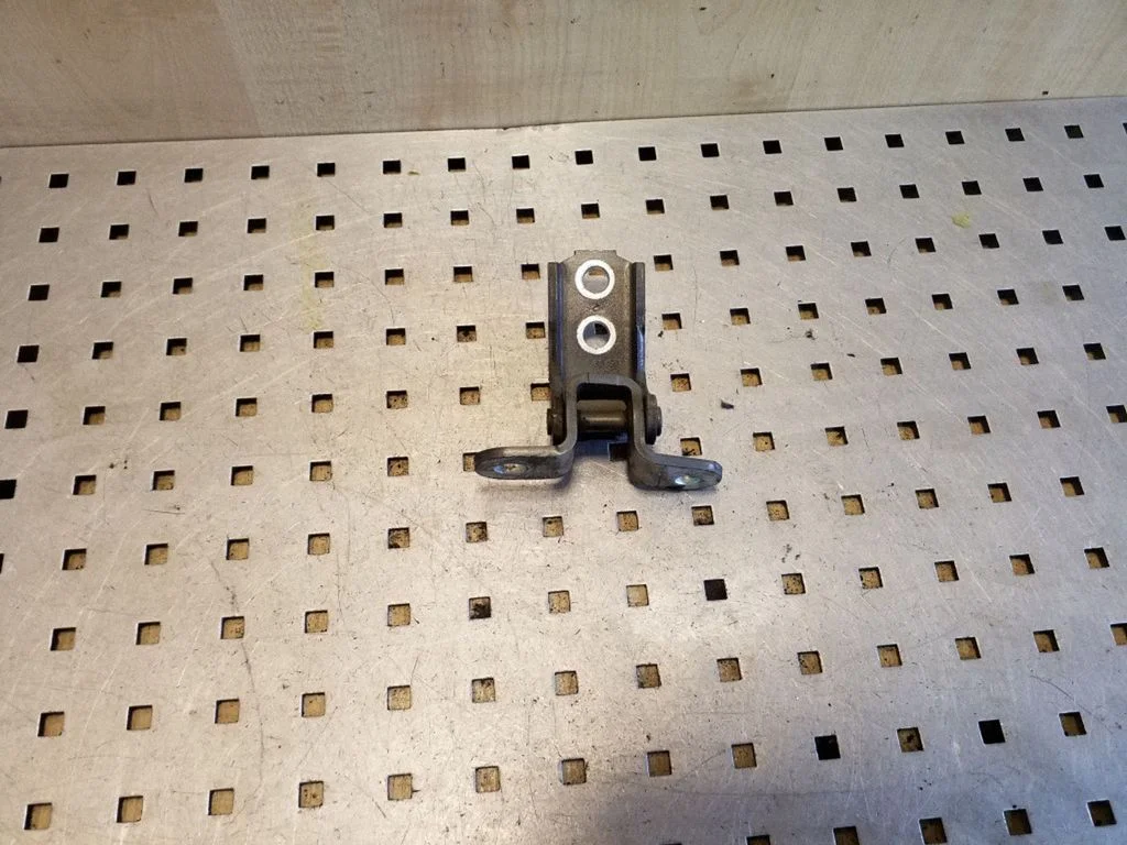 Front door upper hinge – left
