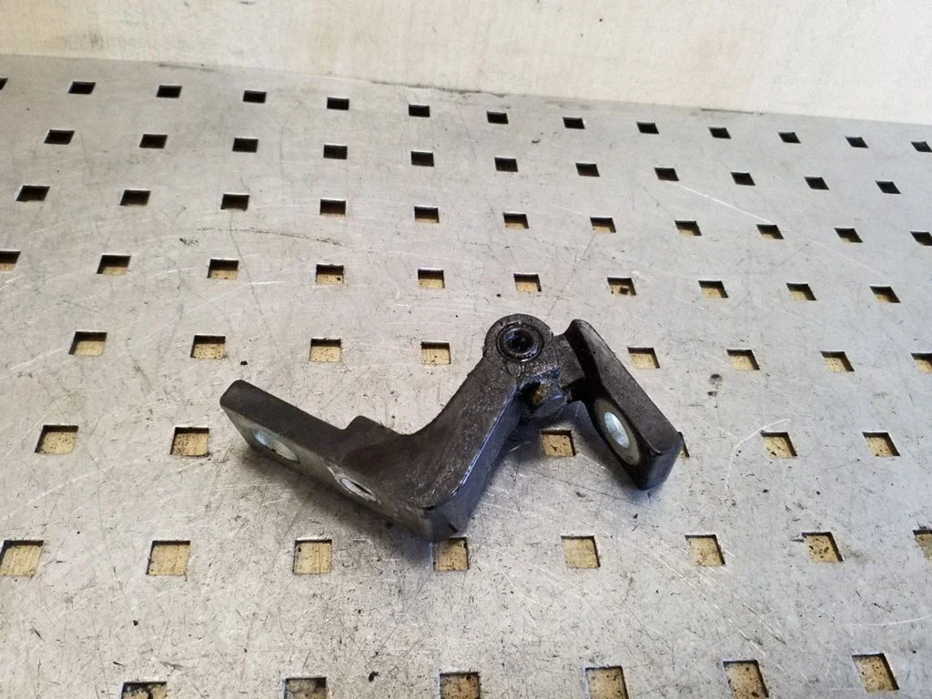 Front door upper hinge – left