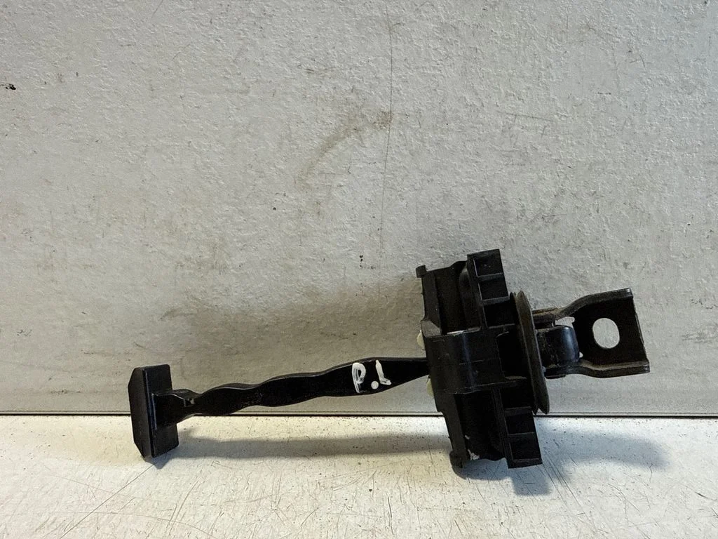 Front door check strap stopper – left
