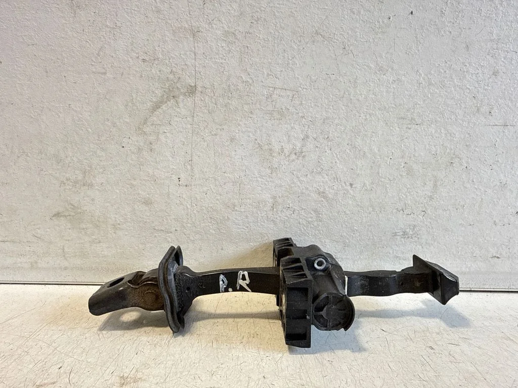 Front door check strap stopper – right