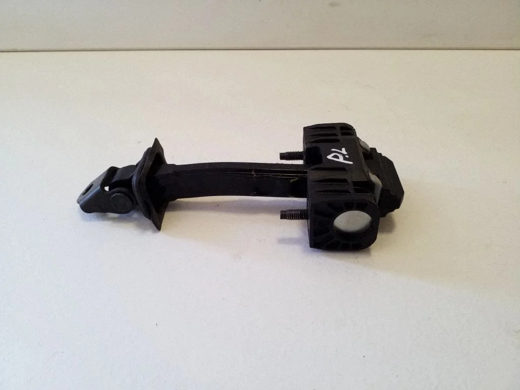 Front door check strap stopper – left