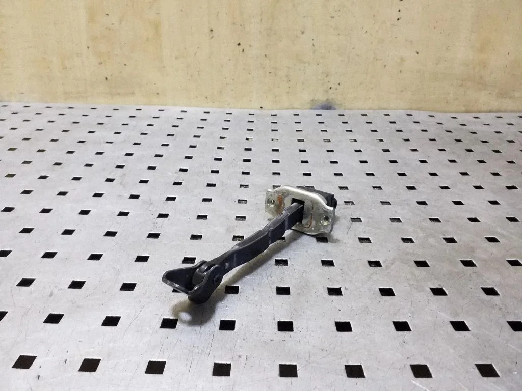 Front door check strap stopper – right