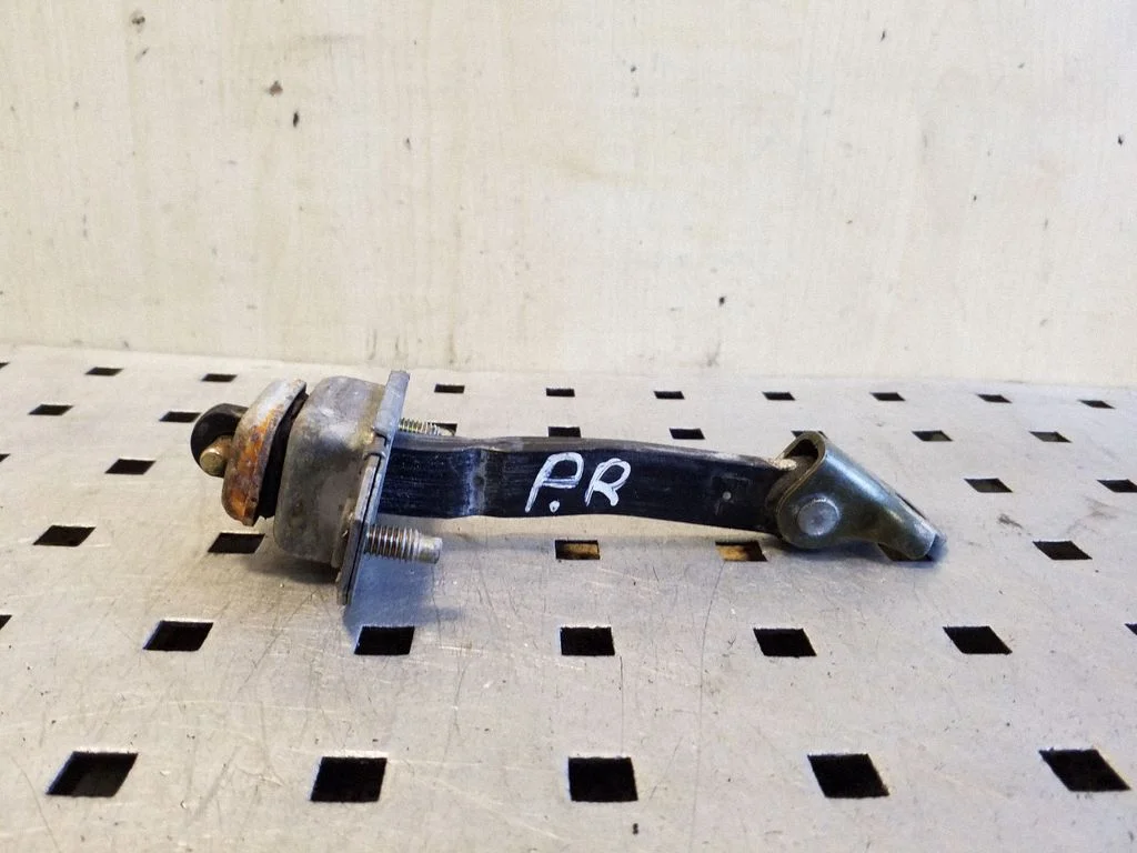 Front door check strap stopper – right