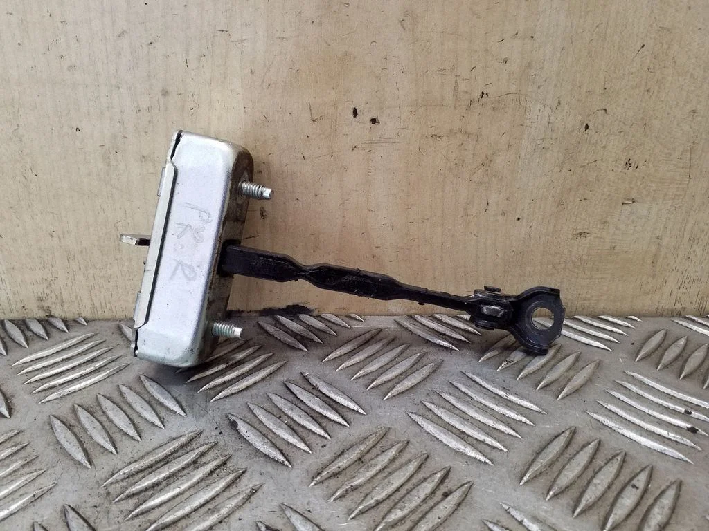Front door check strap stopper – right