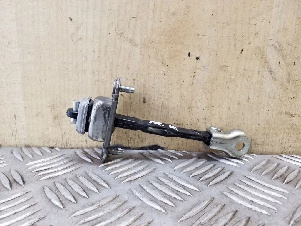 Front door check strap stopper – right