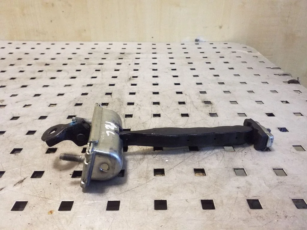 Front door check strap stopper – left