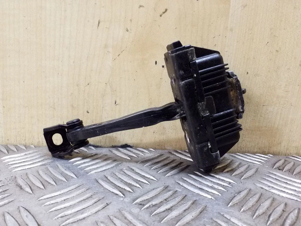 Front door check strap stopper 7176807