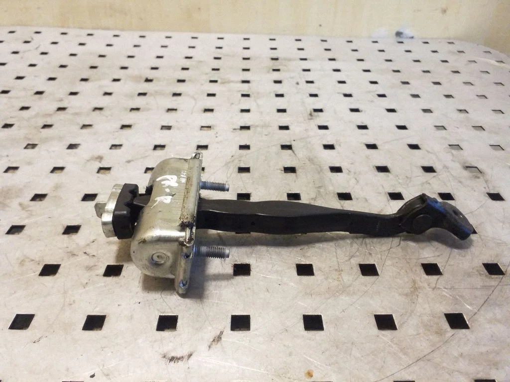 Front door check strap stopper – right