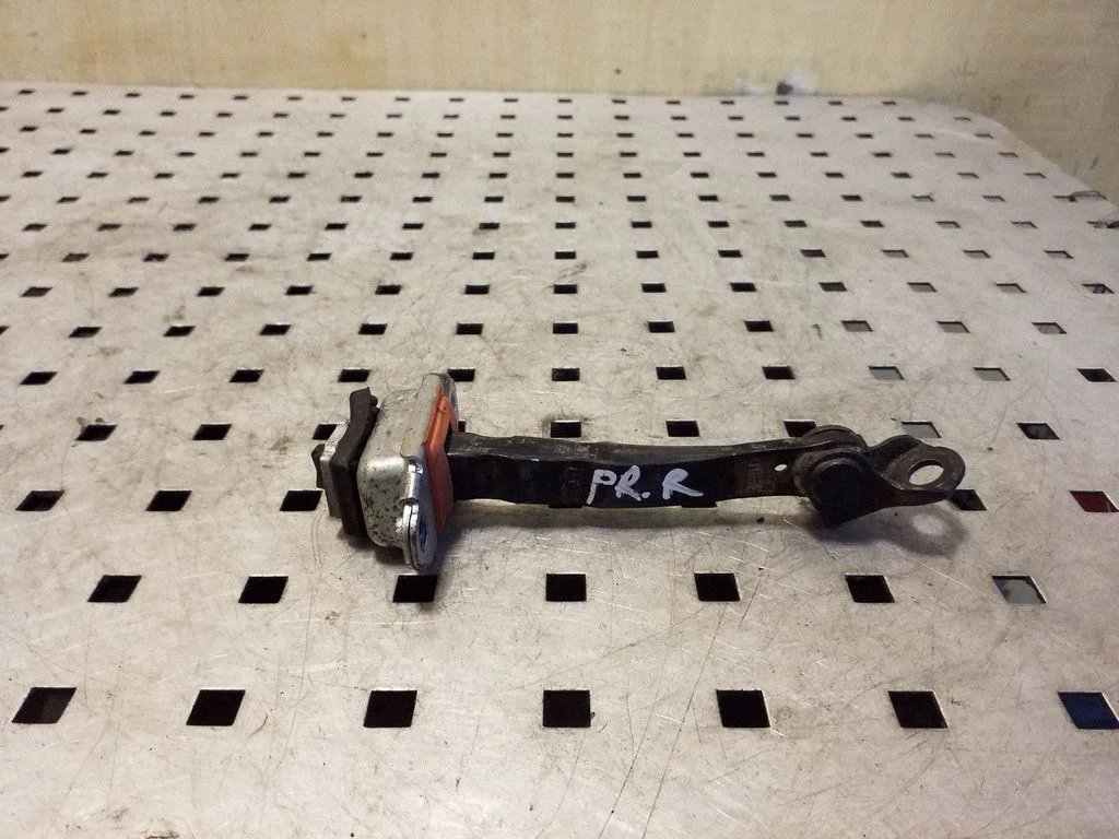 Front door check strap stopper – right