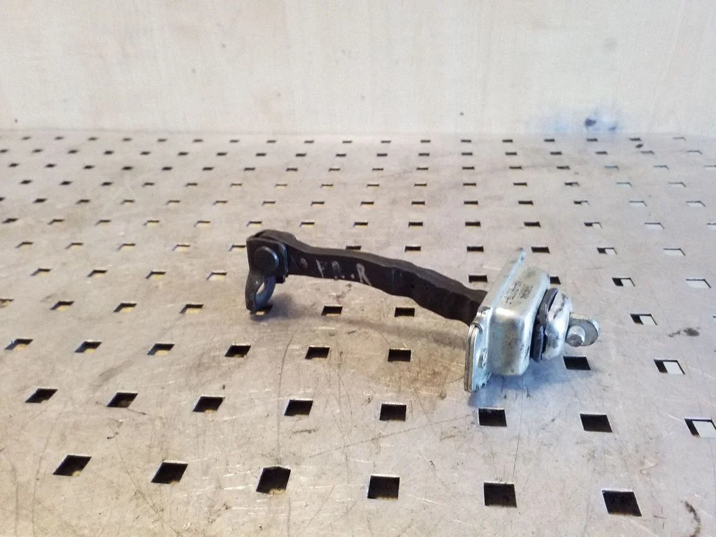 Front door check strap stopper – right