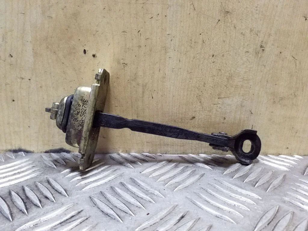 Front door check strap stopper GJ6A58270B