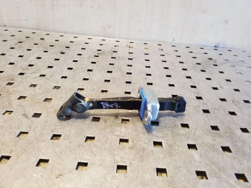 Front door check strap stopper – right