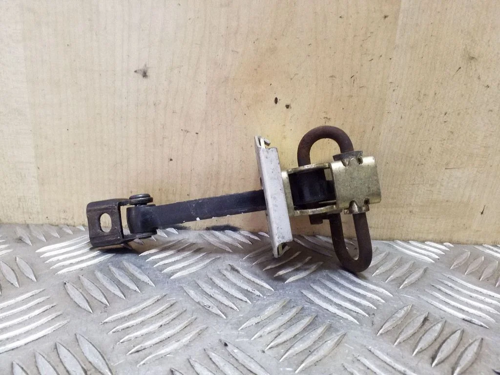 Front door check strap stopper 3330951