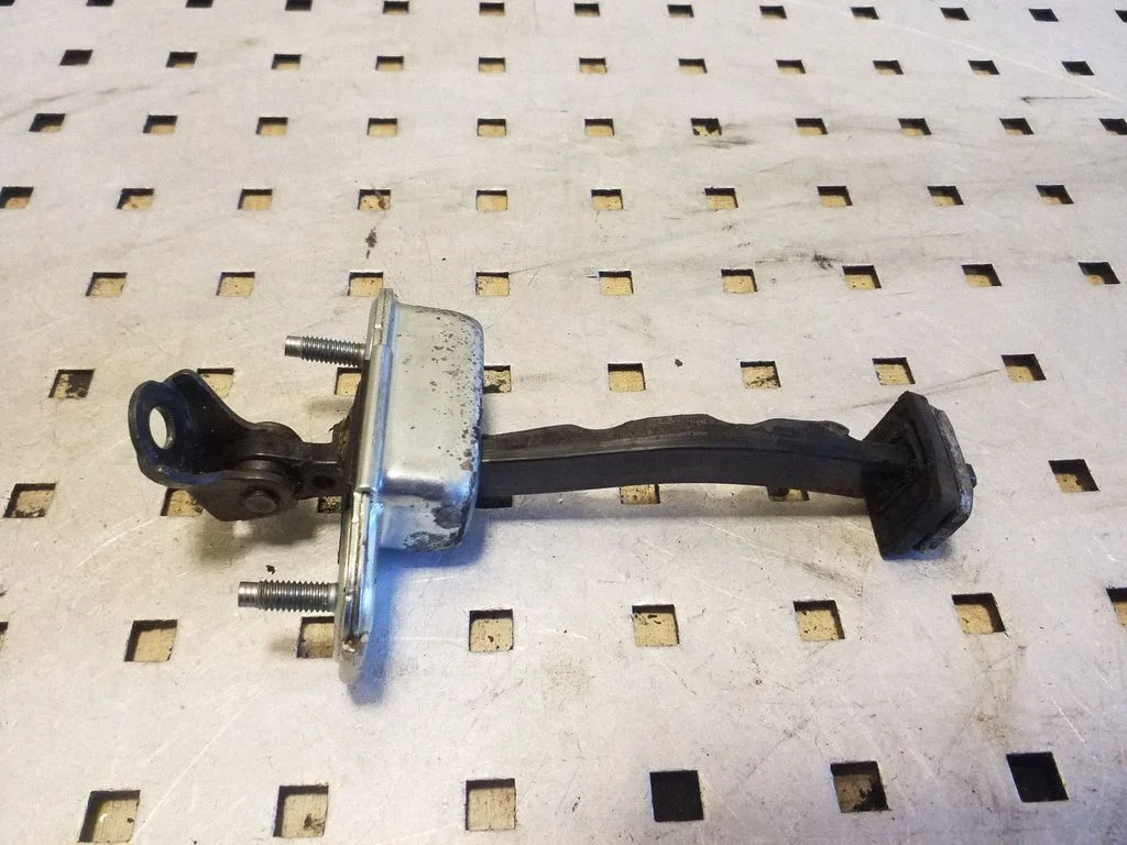 Front door check strap stopper – right