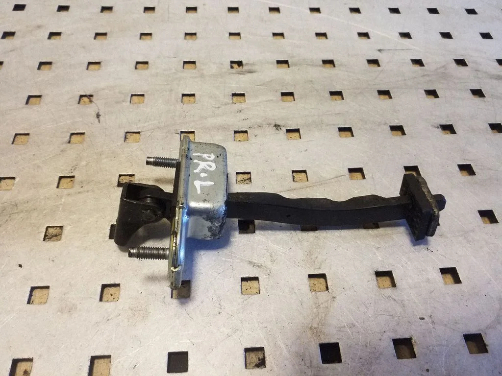 Front door check strap stopper – left