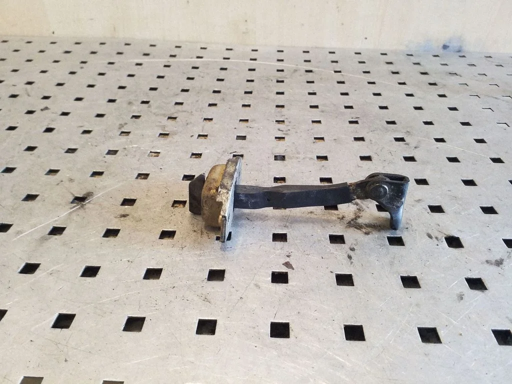 Front door check strap stopper – right