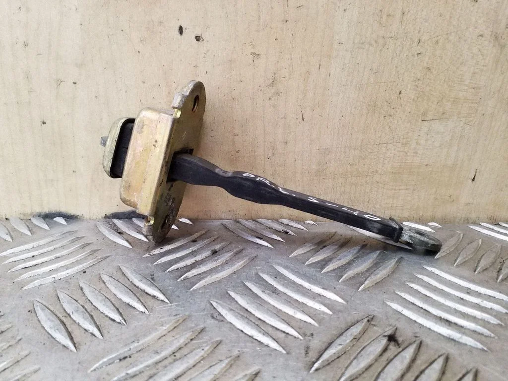 Front door check strap stopper – left