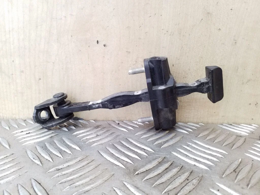 Front door check strap stopper BM51A23500AA