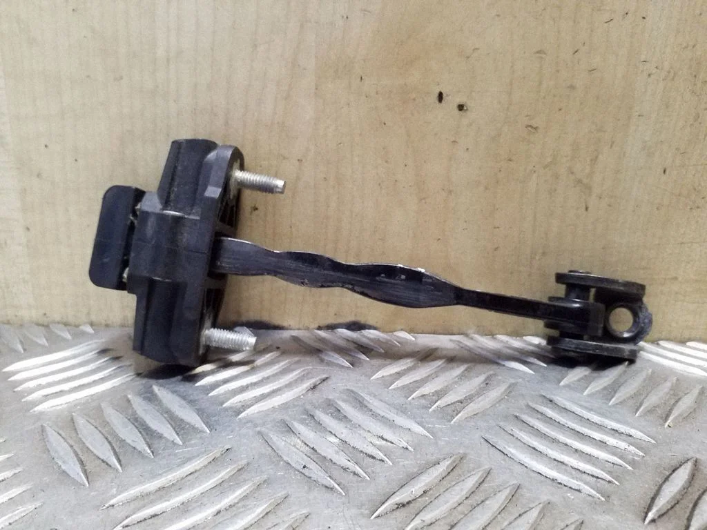 Front door check strap stopper BM51A23500AA