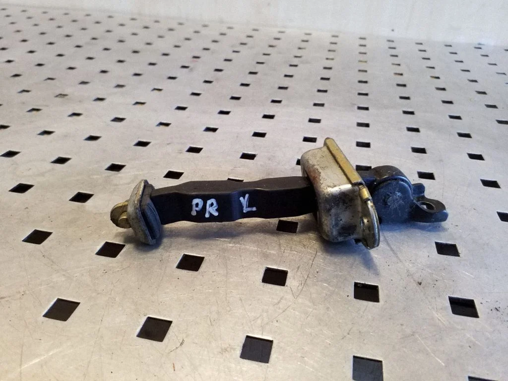 Front door check strap stopper – left