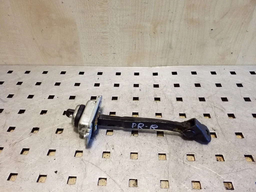 Front door check strap stopper – right