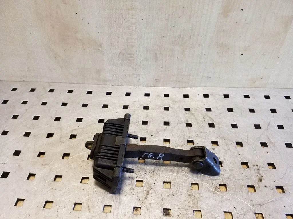 Front door check strap stopper – right