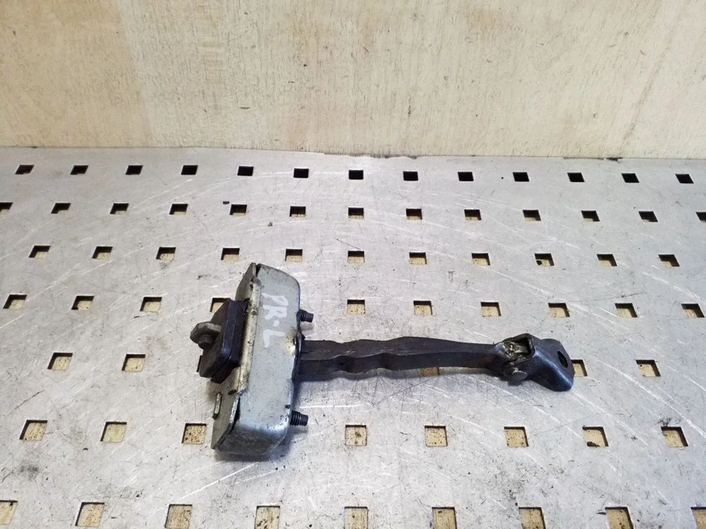 Front door check strap stopper – left