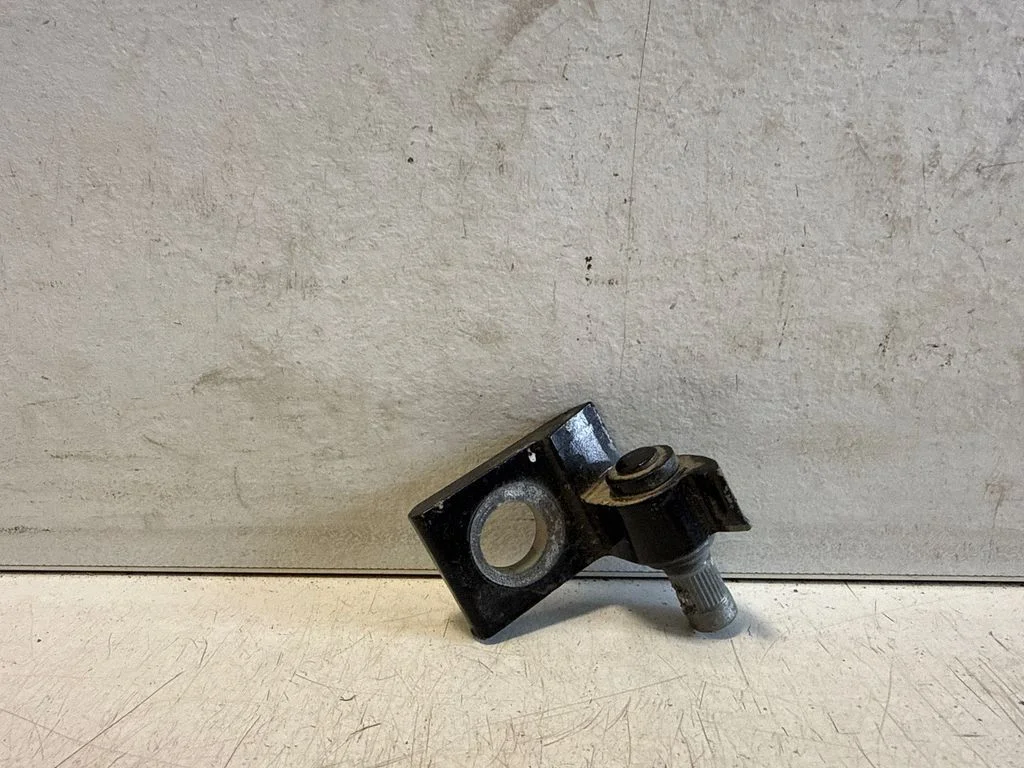 Front door lower hinge – left