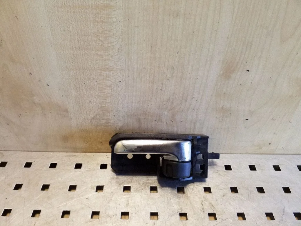 Front door interior handle – left