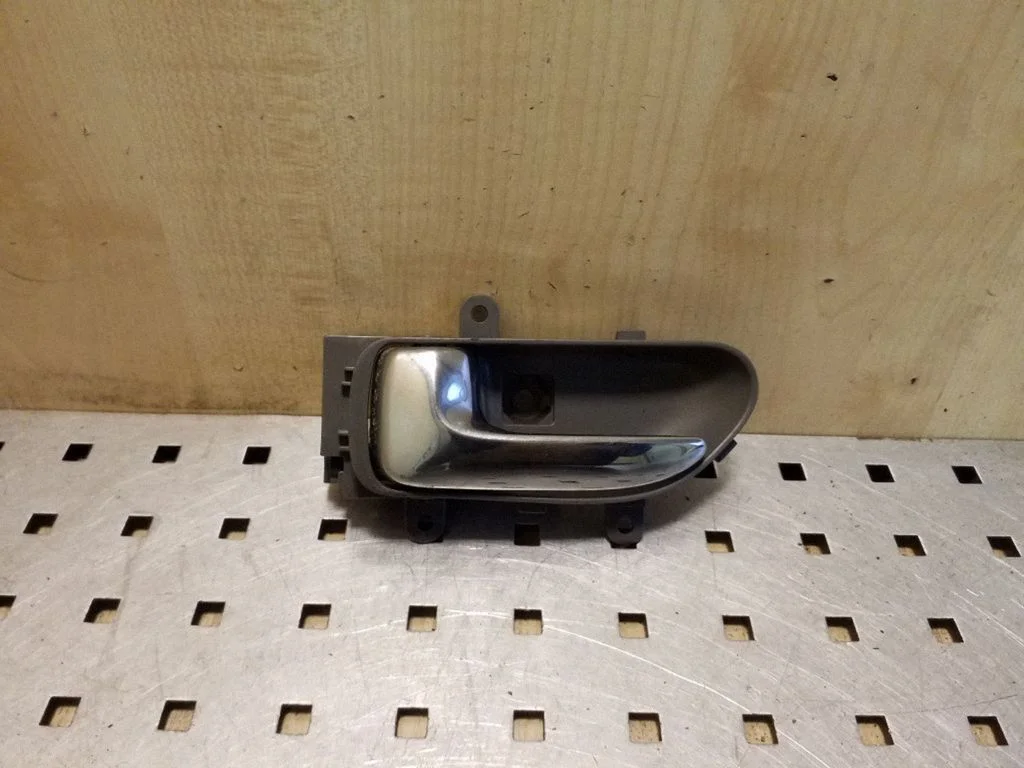 Front door interior handle – left