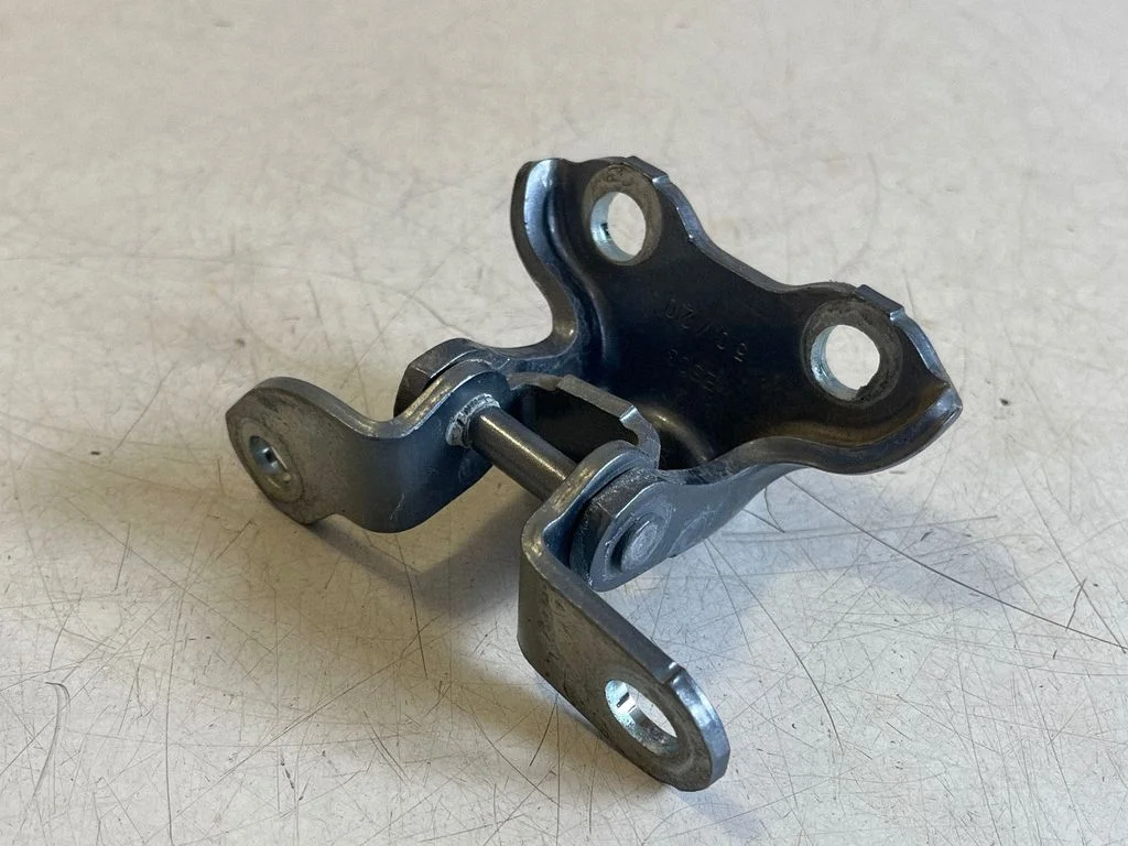 Rear door upper hinge – right