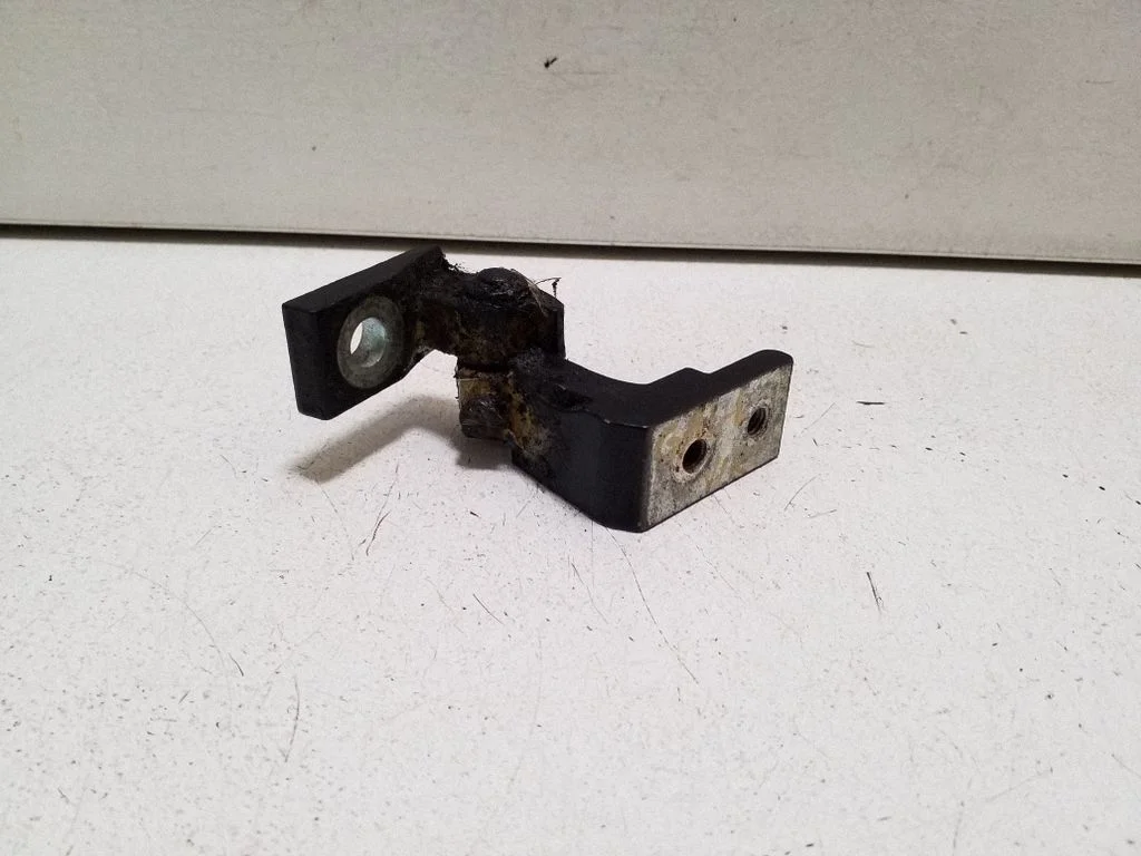 Rear door upper hinge – left
