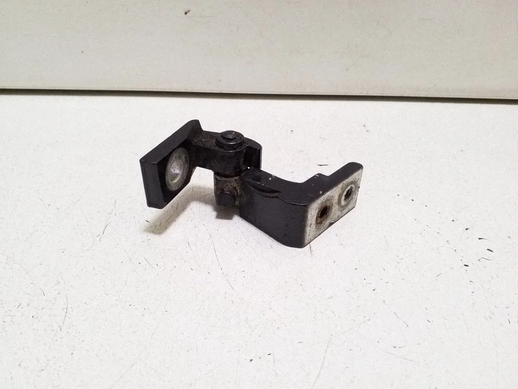 Rear door upper hinge – left