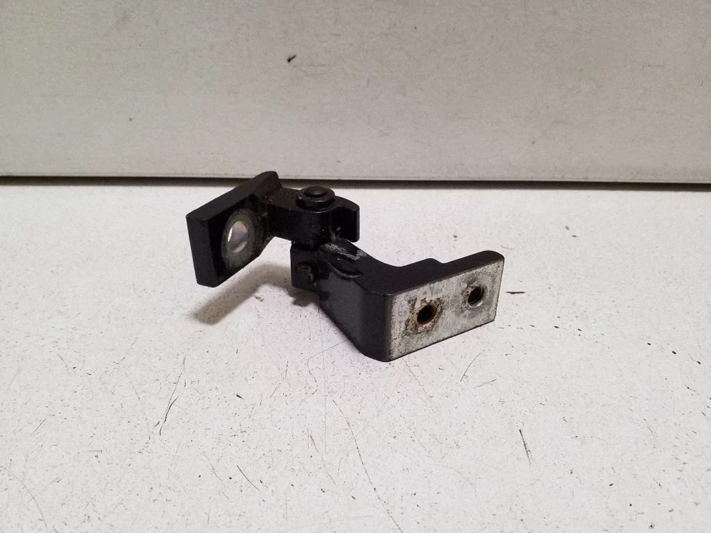 Rear door upper hinge – left