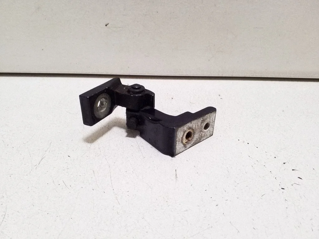 Rear door upper hinge – left