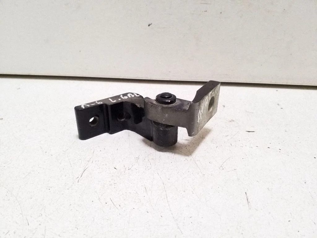 Rear door upper hinge – left