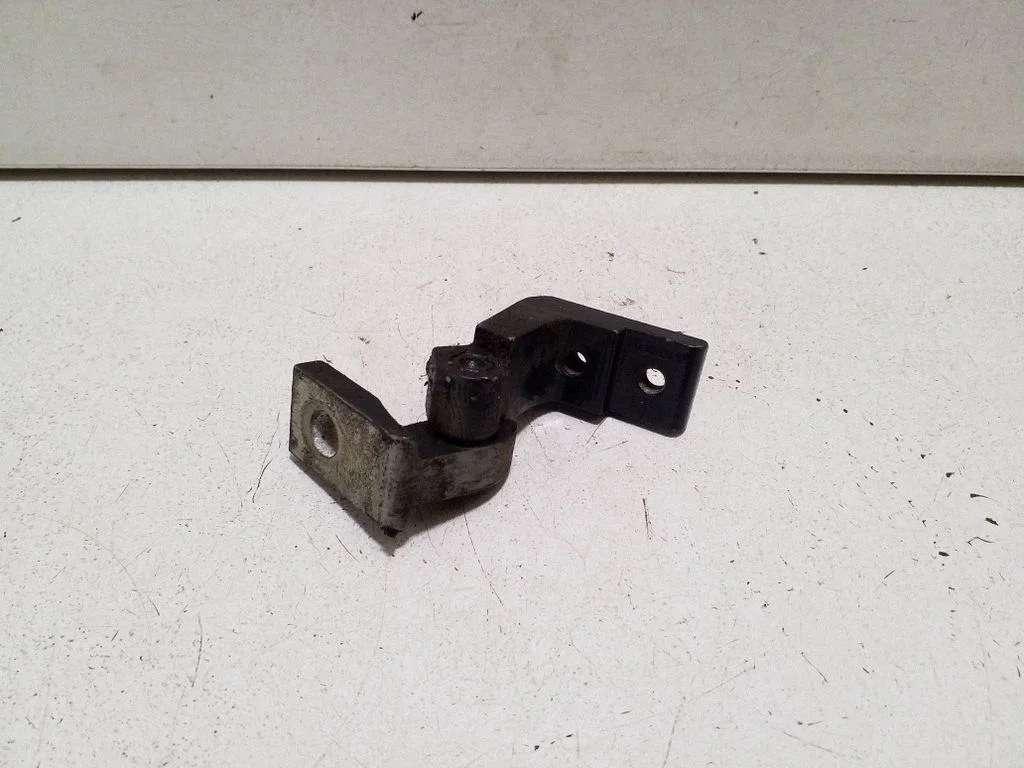Rear door upper hinge – left