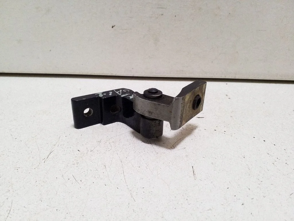 Rear door upper hinge – left