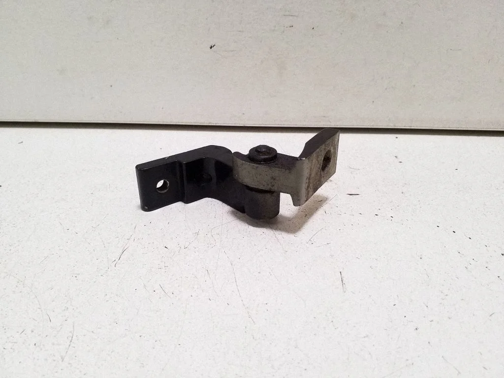 Rear door upper hinge – left
