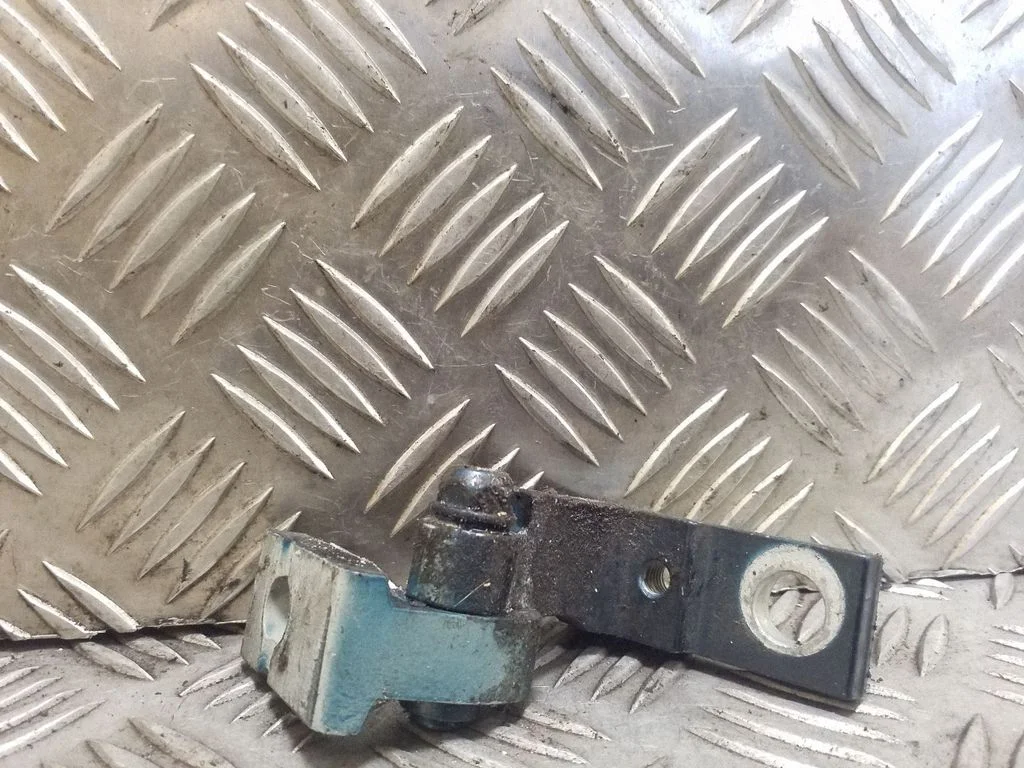 Rear door upper hinge – left